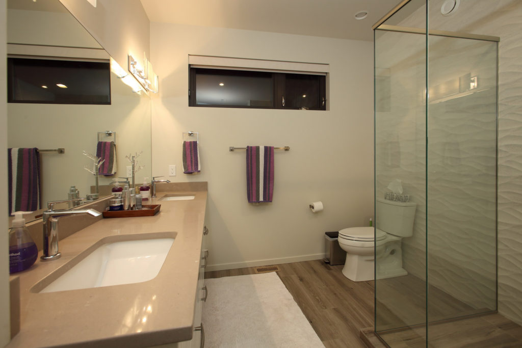 Custom built bathroom with a beautiful, large, stand up shower, double sink and high ceilings. Part of a custom built lake house on the shores of Okanagan Lake. Parsons Family Homes.