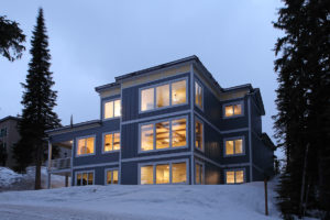 the outside of a custom-built blue silver star mountain resort home by parsons family homes builders in vernon, bc